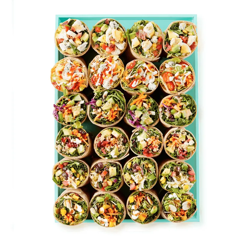 Assorted Freshii catering wraps cut in half and arranged on a platter